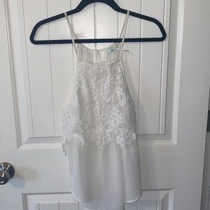 White top with lace detail.